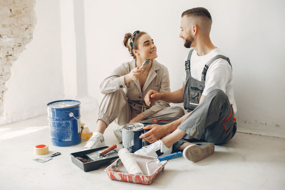 young couple doing repairs